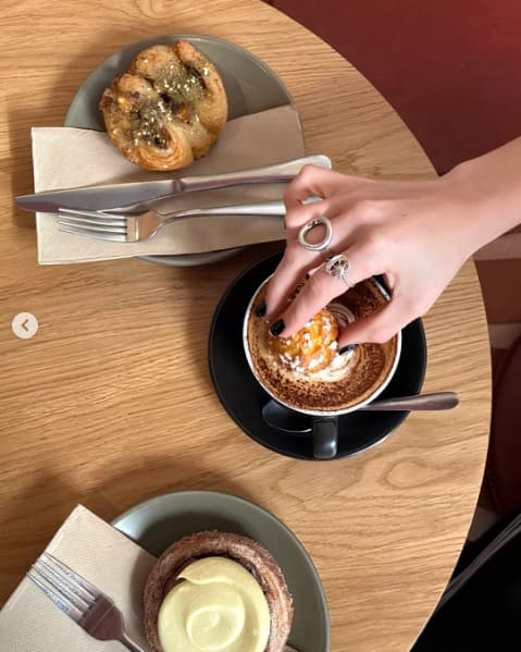 Wholegreen Instagram capture showing a cream-topped pastry with coffee